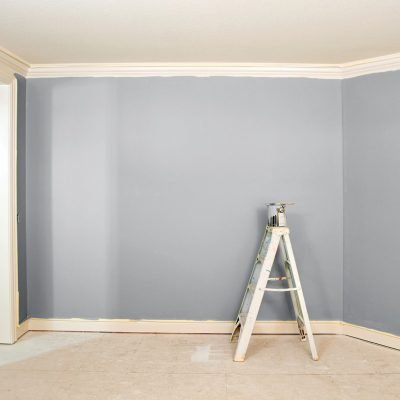 a room that is having the walls painted with a cool, neutral blue color